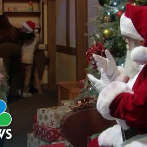 Santa Claus Spreading Holiday Cheer To Deaf Children Using Sign Language