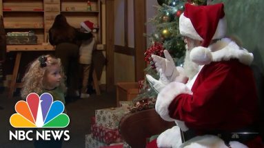 Santa Claus Spreading Holiday Cheer To Deaf Children Using Sign Language