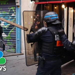 Tear gas and fireworks as pension protests turn violent in Paris