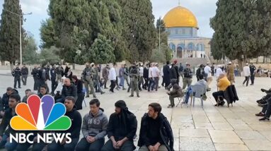 Jewish visitors are escorted by Israeli police as they tour Jerusalem's Al-Aqsa Mosque compound