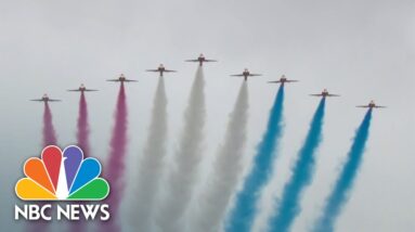 King Charles III and Queen Camilla watch royal flyover from balcony