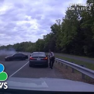 Watch: Car spins out of control crashing into officer making traffic stop
