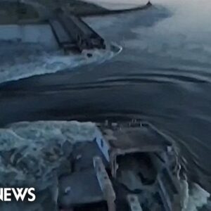 Drone video shows water surging through a huge hole in Ukraine's Kakhovka dam