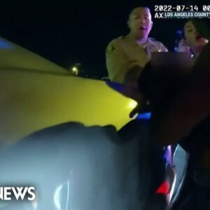 Bodycam video shows LA sheriff's deputy punch mother holding baby