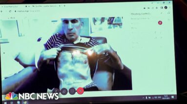 Former Georgian president bares his chest during court appearance