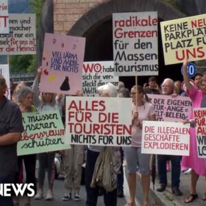 Residents of beautiful Austrian town block tunnel in protest over tourism