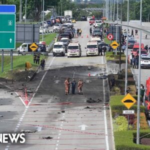 Passenger jet crash onto highway kills 10 in Malaysia