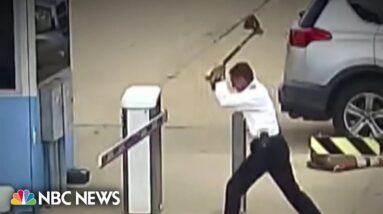 Pilot accused of attacking Denver airport parking lot gate with ax