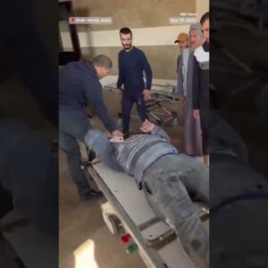 Injured people pour into a hospital in Gaza following an Israeli airstrike