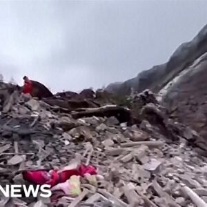 Video shows a huge scar on mountainside after a landslide hits a village in China