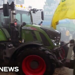 Video shows farmers driving tractors into Brussels as part of a protest