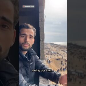 People gather at the beach to await aid and food supplies in northern Gaza